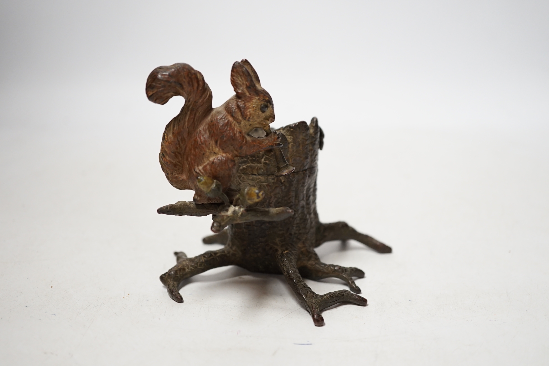 A cold painted bronze inkwell with squirrel, marked ‘Guschutzt’, 10cm